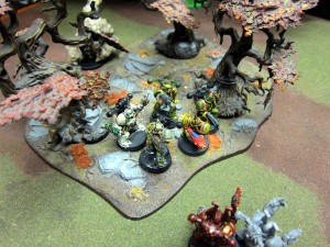 Colin's Plague Marines defend a rotted wood as Khorne makes a move on Nurgle's territory...