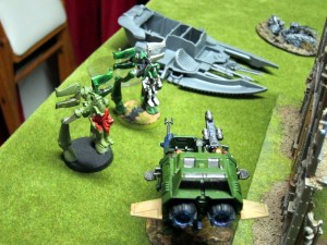 Fresh off barbecuing some Dire Avengers in their downed Wave Serpent, a Landspeeder is ambushed by War Walkers.